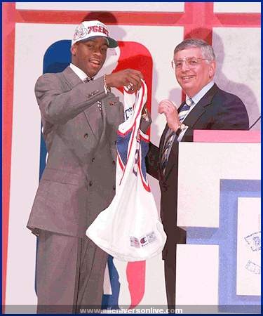 allen iverson wearing his new jersey over his draft day suit will